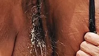 Mature Latina granny with hairy pussy stopping to piss in the desert