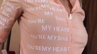 Massaging the redhead girl with a strap-on