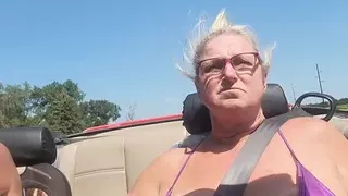 Tits out while riding in a convertible