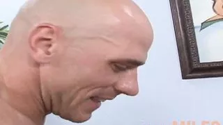 Milf brunette with pierced fake tits gets a wet facial