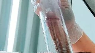 Pumping dick wearing latex medical gloves