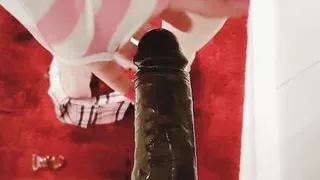 Sissy Tina Noxx fucks a big black dildo in the shower