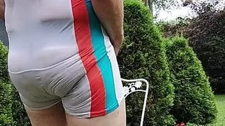 Dad hosing off in the yard