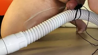Small Penis With Vibrator Eggs Holding A Vacuum Hose