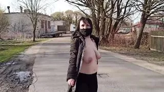 Naked, shameless wife walks down the street in a public place