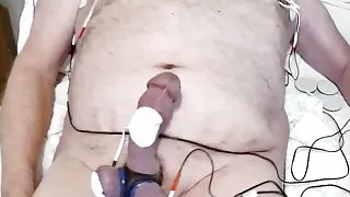 HFO estim-Elvis puts 18 volts to work on his cock, balls and nipples. To make sure he comes... 100 whacks to his balls.