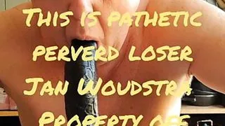 Sucking  a black dildo