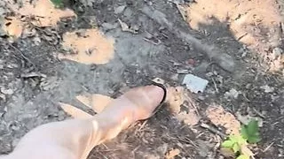Walking in forest in shiny stocking and high heels