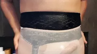 Full cut nylon panties and D cup pink bra under the shower