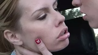A stunning lesbian blonde is comforting another sex depraved stunner in the parking lot