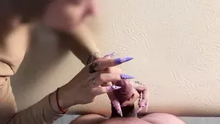 Long nails scratching cock and balls