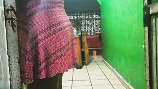 chubby mexican wife preparing dinner in the kitchen