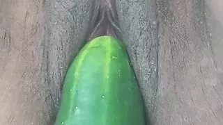 a large cucumber and a cigarette in my pussy
