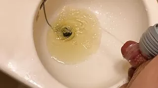 Small Penis With A Vibrator Sleeve Cumming And Pissing On Sink