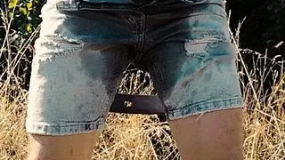 Scallyoscar piss drinking and soaking ripped denim shorts outdoor
