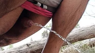 squat pissing open air