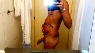 Twink shows off stuffed belly and making uncut cock hard in hotel room