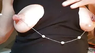 nippleringlover horny milf inserting necklace through extreme stretched pierced nipples kinky nipple play