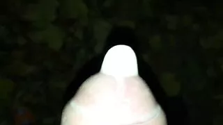 Close up filling condom with cum at public