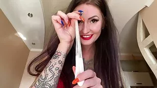 Dominatrix Nika poured a condom with sperm on her slave's head. Slave humiliation, cum play, sexy dominatrix.