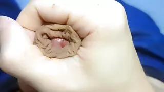 Playing with his foreskin dick