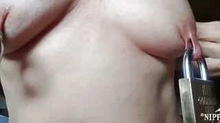 nippleringlover horny milf inserting heavy padlock in extreme stretched pierced nipples kinky nipple play