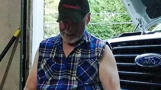 Mechanic relaxing at end of work day