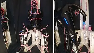 Strapped to Fucking Machine Chair in PVC Catsuit Gagged in Chastity