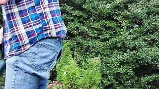 Gardener dad moving plants, then takes a break for a smoke