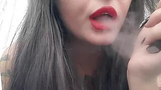 Sexy smoking fetish from Dominatrix Nika. Mistress smokes 2 thin cigarettes in a row, and you smell her smoke.