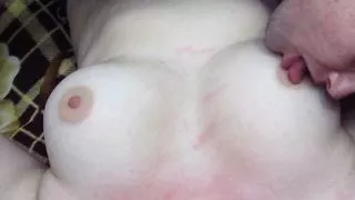 Husband licks his young wife's big natural tits and nipples