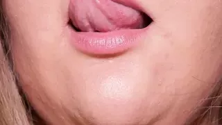 Fat girl sensually licks her plump lips