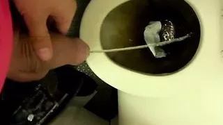 Twink piss on the airplane toilet - thick soft uncut cock