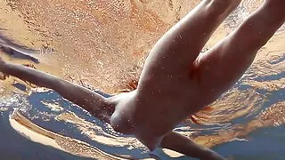 Cute pink bikini babe Lera underwater