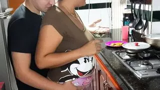 My stepmother gives me a rich blowjob in the kitchen.