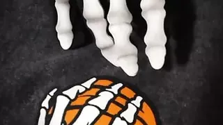 An skeleton touching boobs and pussy