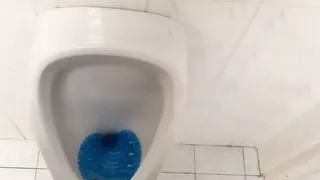 Peeing and moaning after pee desperation at the public urinal