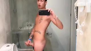 Quick hotel bathroom cumshot into sink in swim trunks while friend is gone