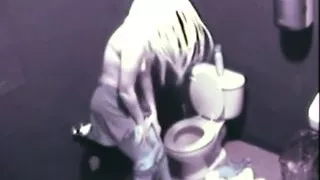 Hot Blonde fingering her pussy public toilet