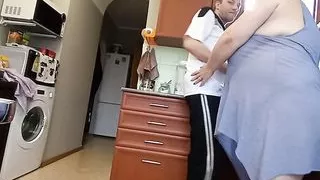 in the morning in the kitchen, a fat woman jerks off my cock to a cumshot